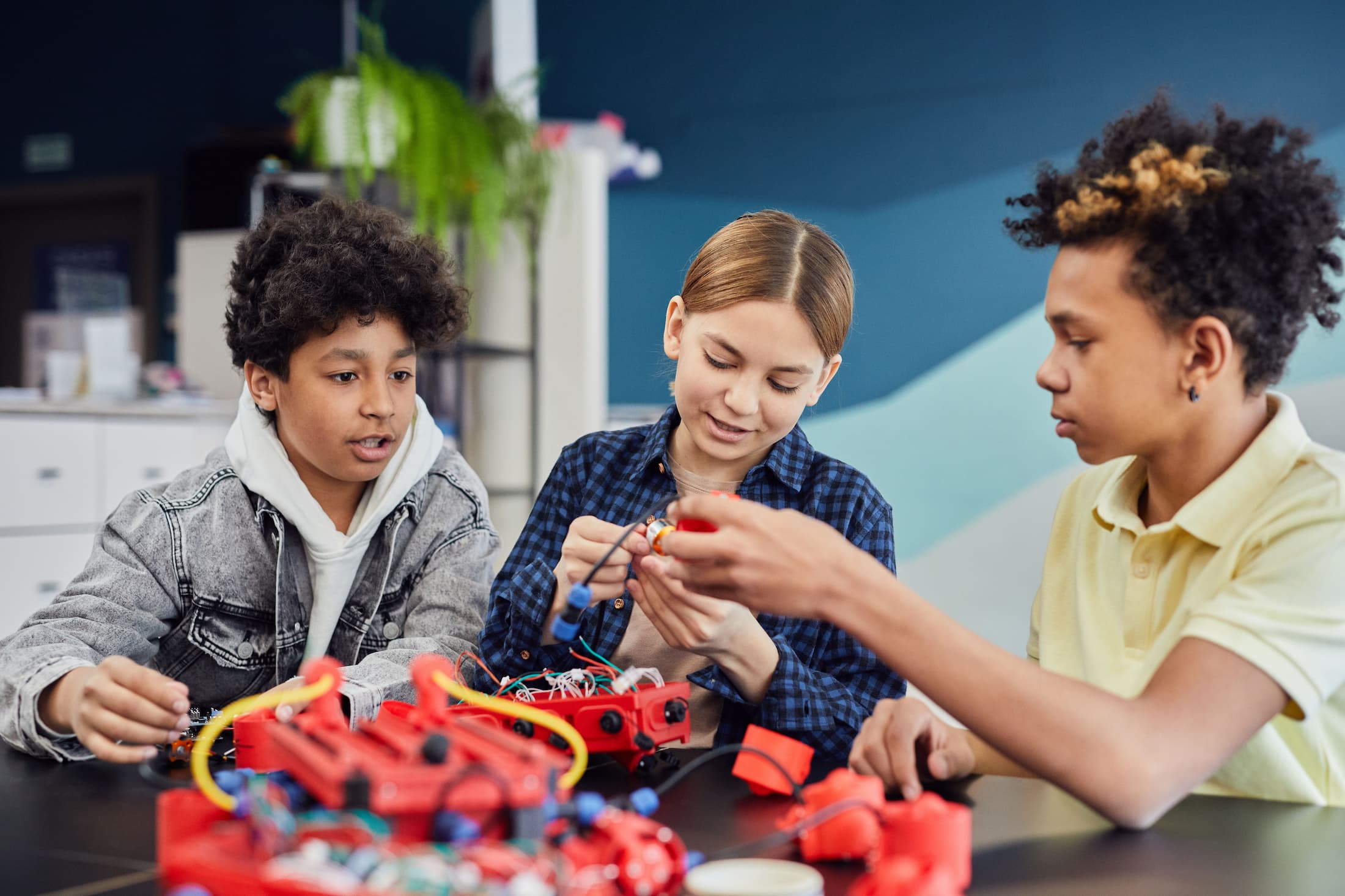 Young students working on robotics project together